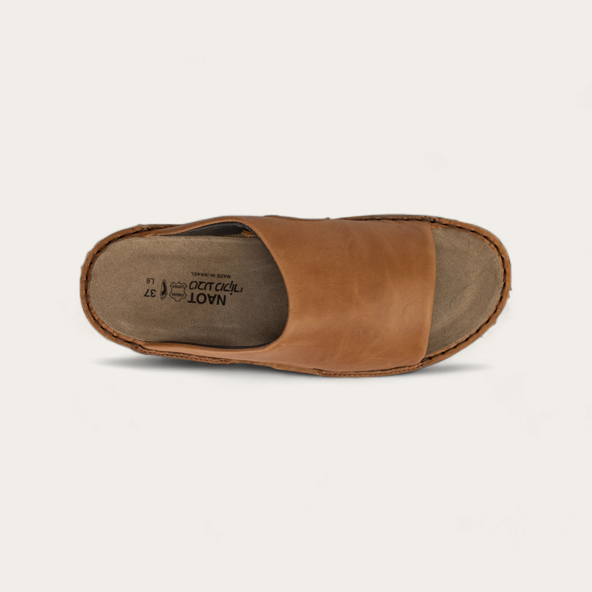 A brown slip-on sandal