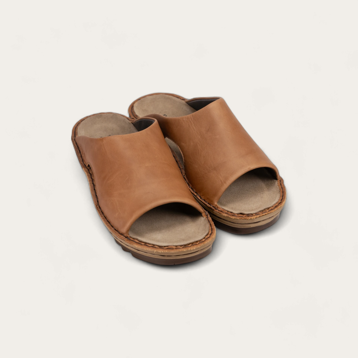 A brown slip-on sandals