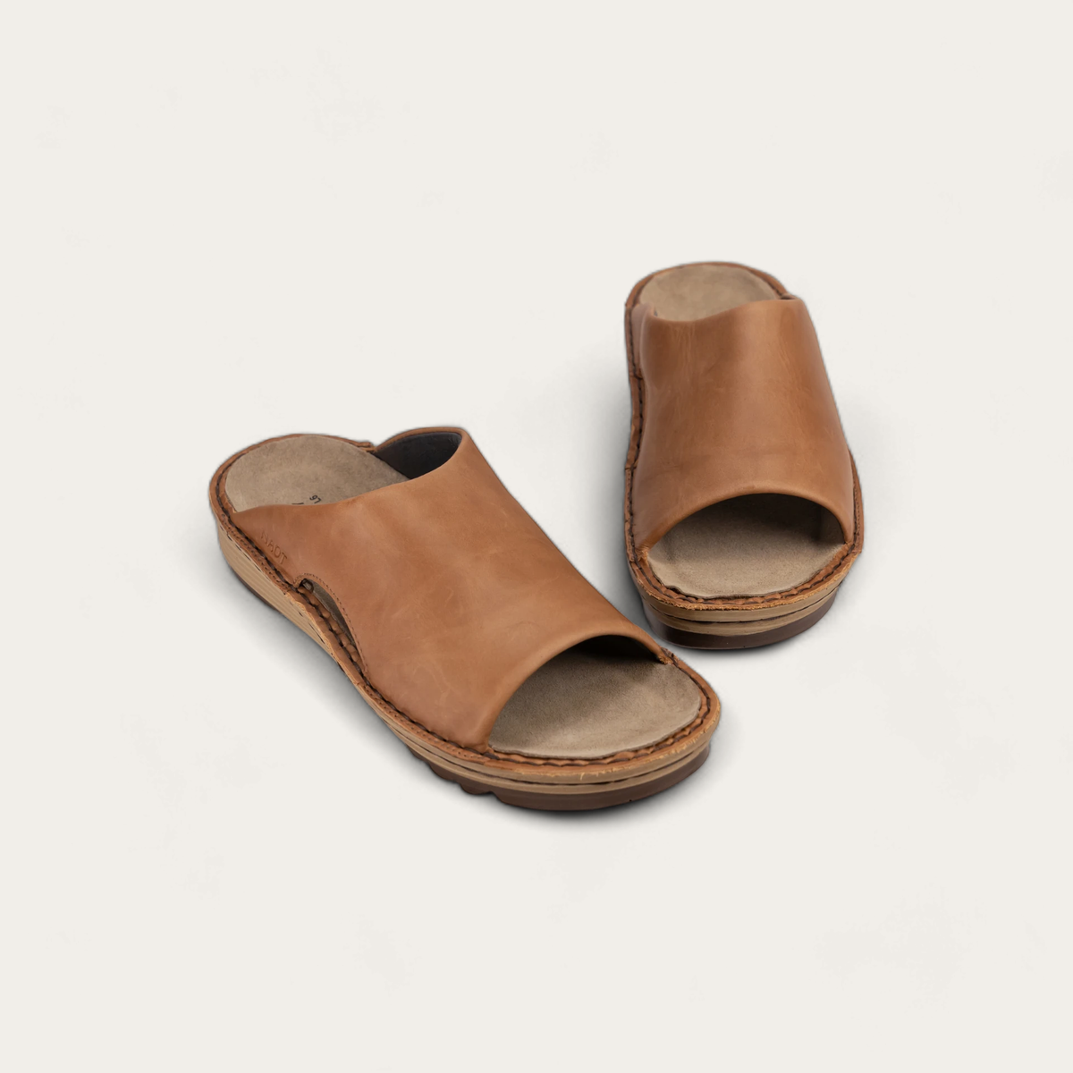 A brown slip-on sandals