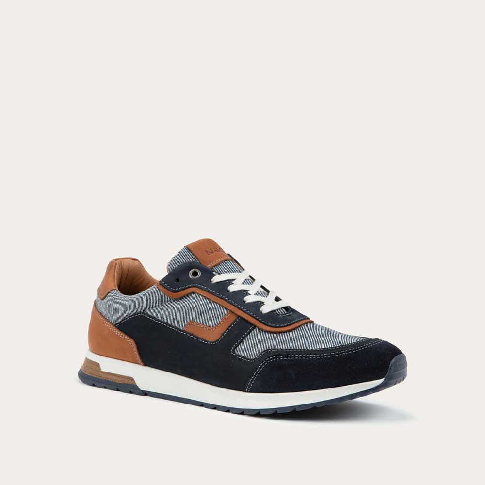Angled profile view of a blue and brown sneaker featuring different materials on a white sole