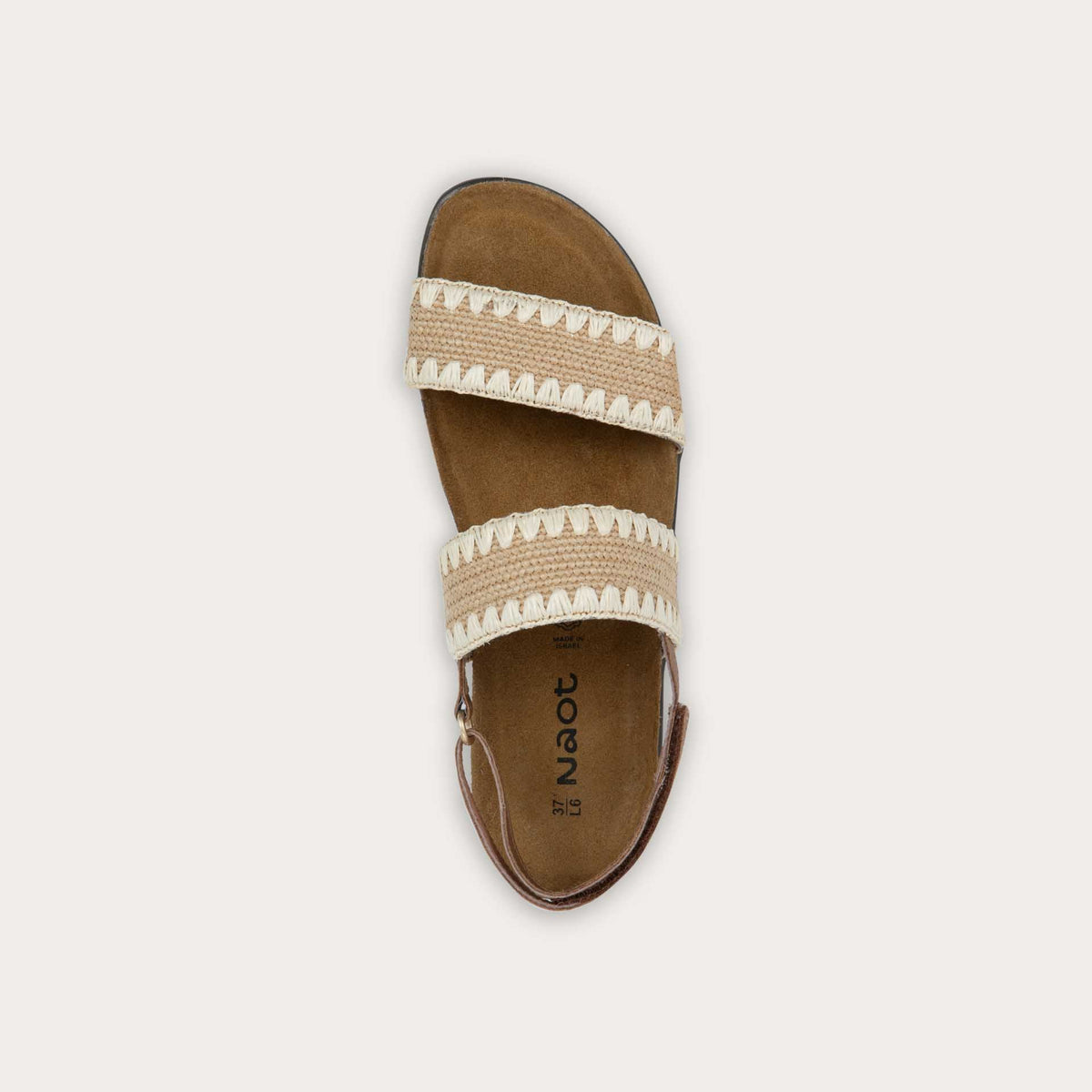 Top view of a brown sandal featuring two textured toe straps and an adjustable ankle strap on a cork footbed.