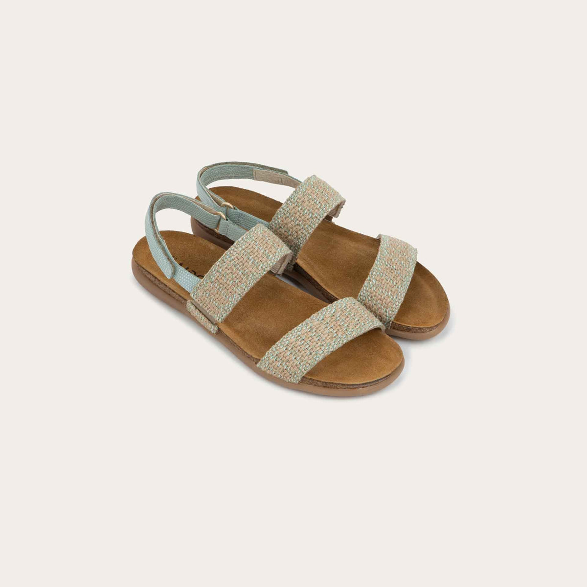 Pair of  green sandals featuring two textured toe straps and an adjustable ankle strap on a cork footbed.