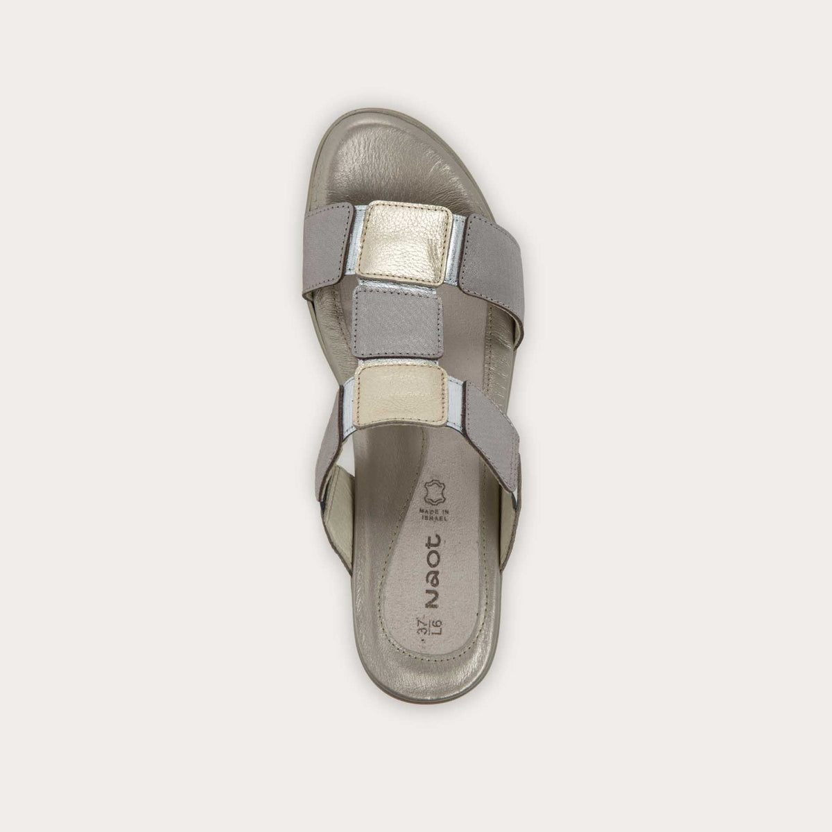 Top view of a slip-on t-strap black sandal with a mid-height heel .