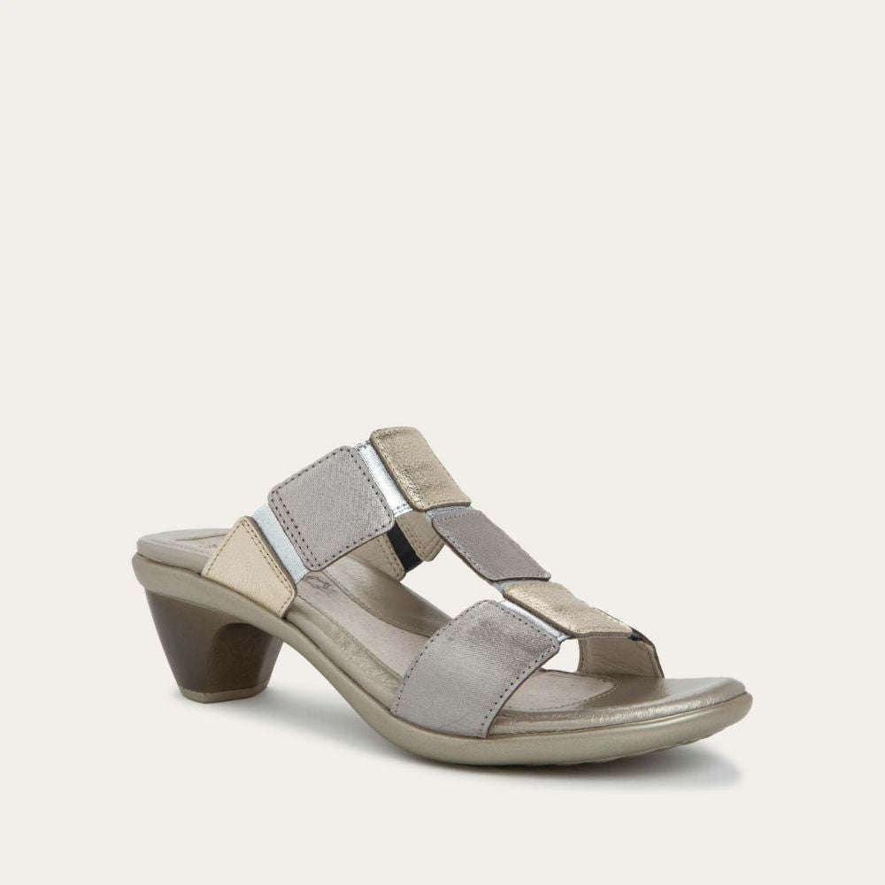 Angled profile view of a slip-on t-strap black sandal with a mid-height heel .