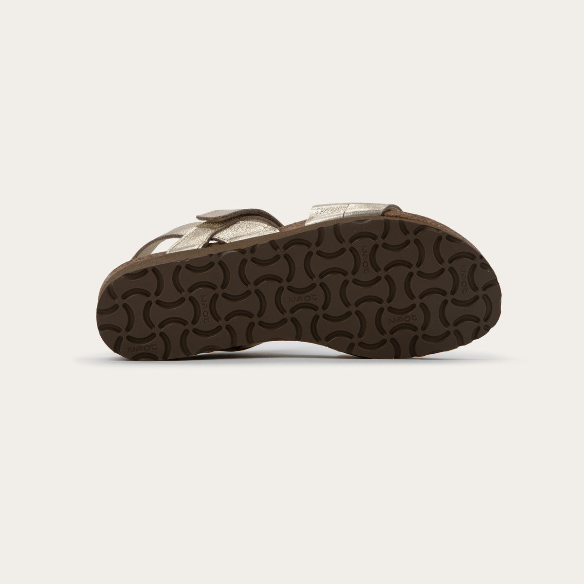 Bottom view of a brown leather sandal with two toe straps, an adjustable ankle strap, and a cork platform sole.