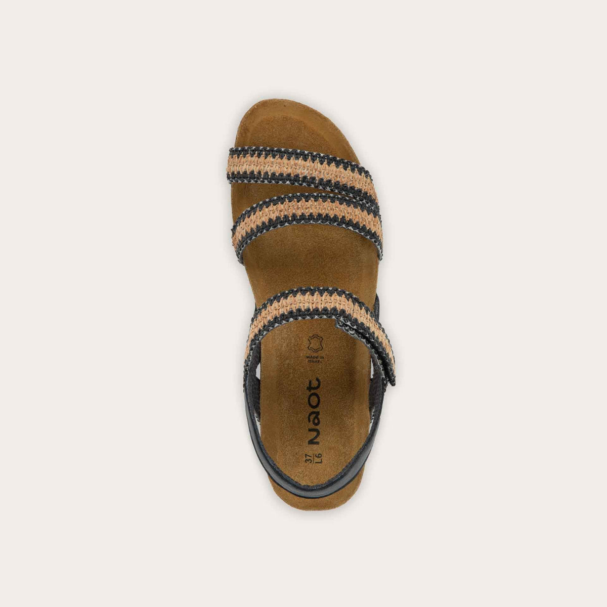 Top view of black and brown raffia sandal with a cork footbed, black sole, and triple-strap design including a crisscross ankle strap.