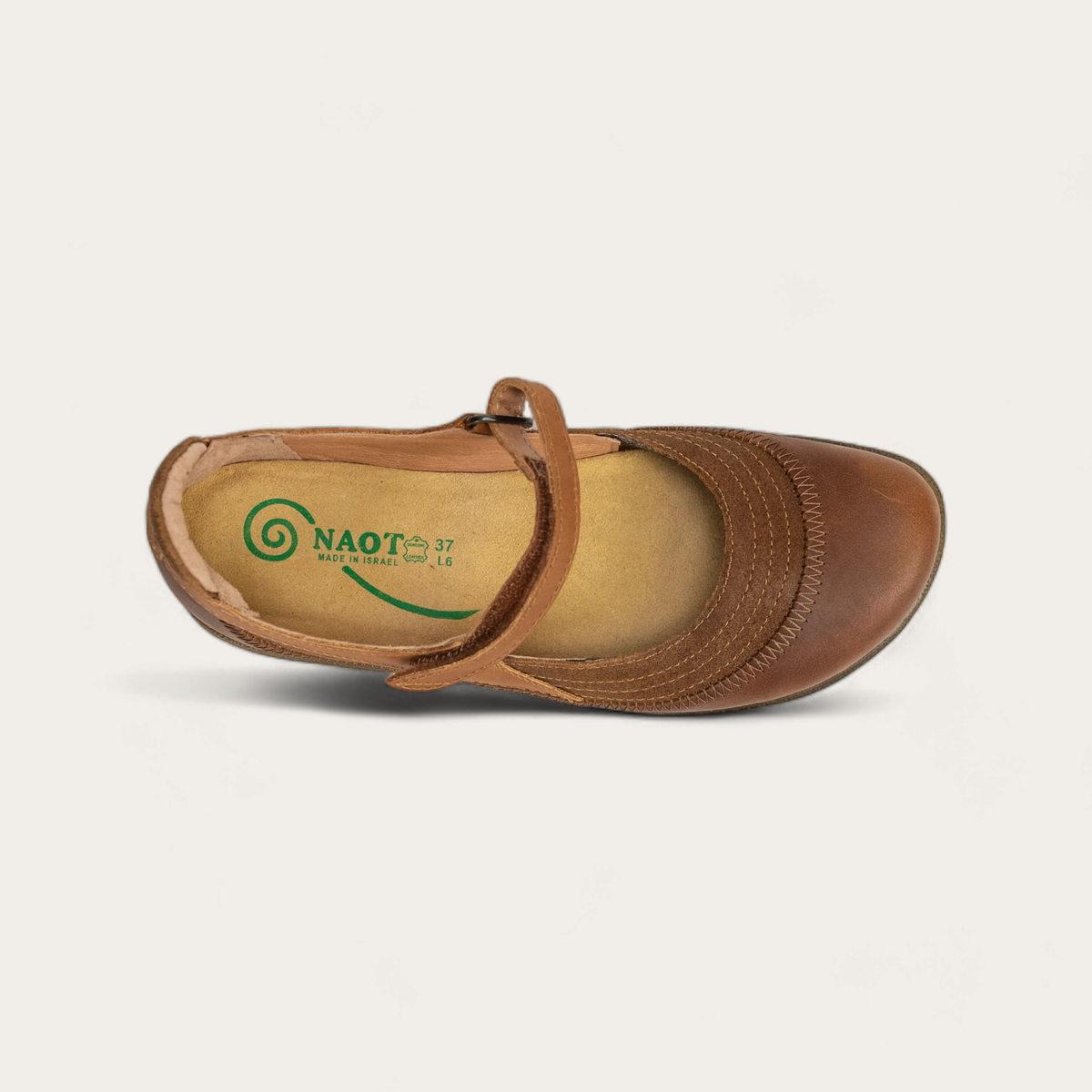 Top view of a brown leather Mary Jane shoe with a hook-and-loop strap