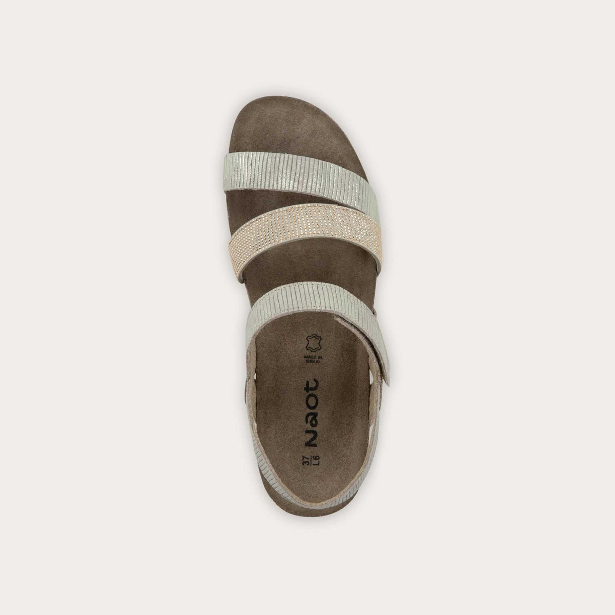 Top view of a gray sandal with two textured straps and a studded strap on a cork and black rubber sole,