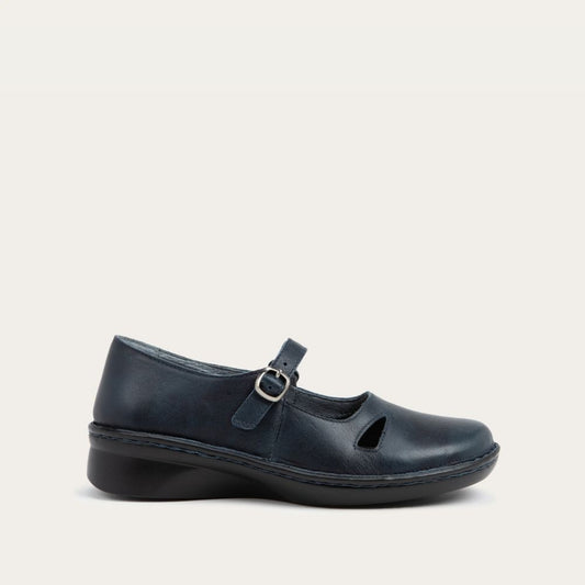 Profile view of a black maryjane on a black sole featuring a simple buckle and small cutout detail on the side
