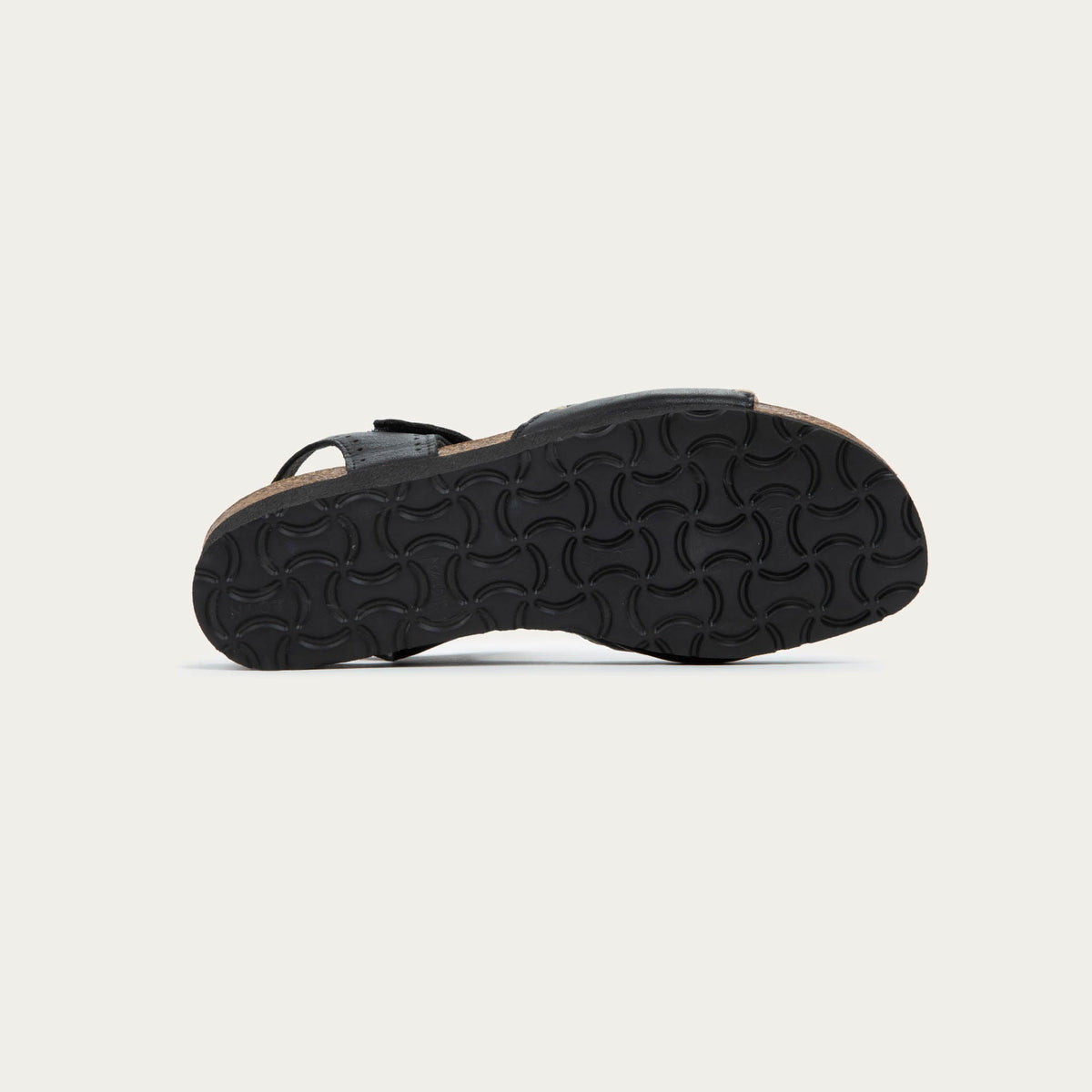 Bottom view of black and brown raffia sandal with a cork footbed, black sole, and triple-strap design including a crisscross ankle strap.