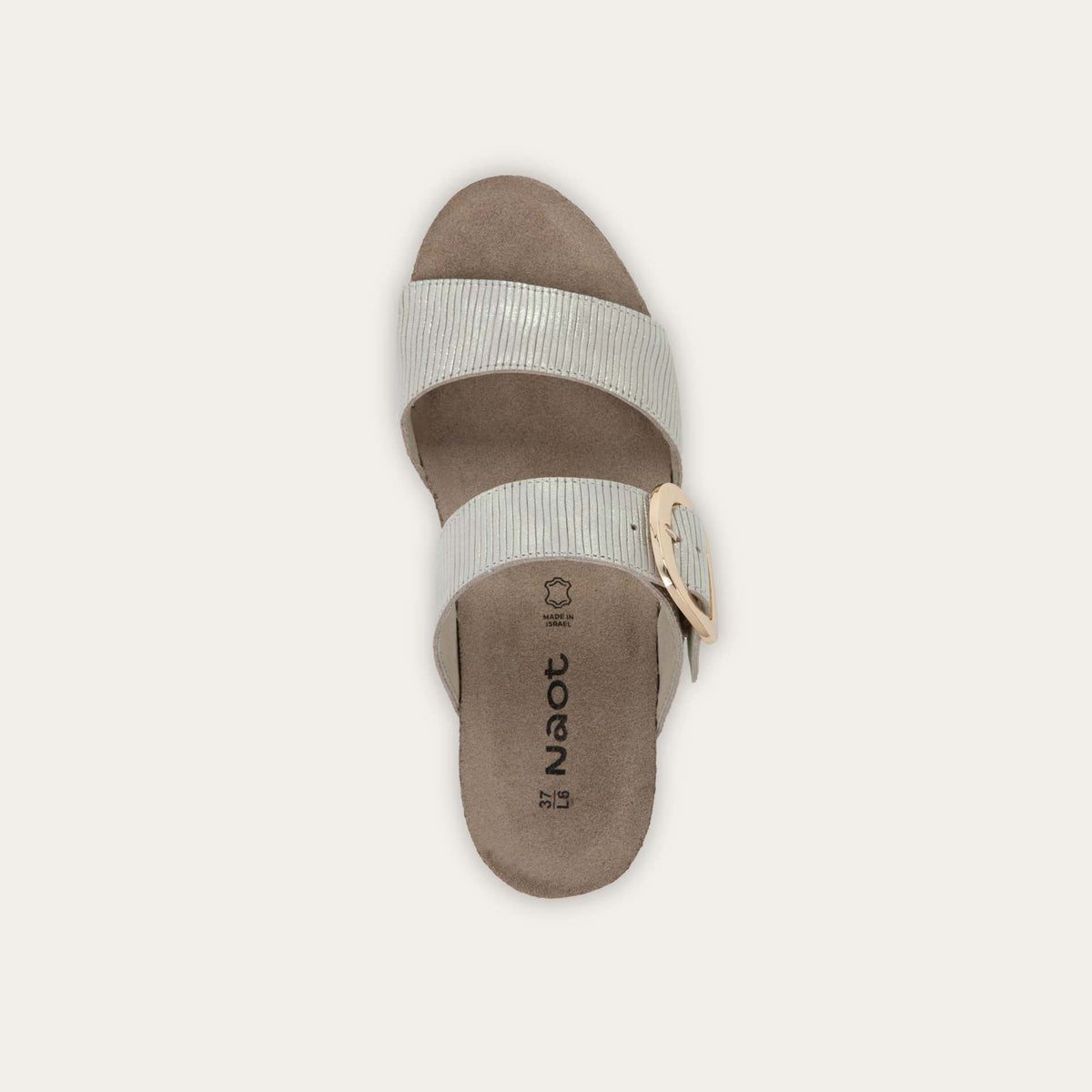 Top view of a metallic gray textured wedge sandal with two straps and a large gold buckle. 