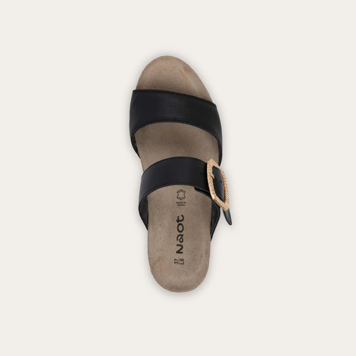 Top view of a black slip-on wedge sandal with two straps and a large textured buckle. 