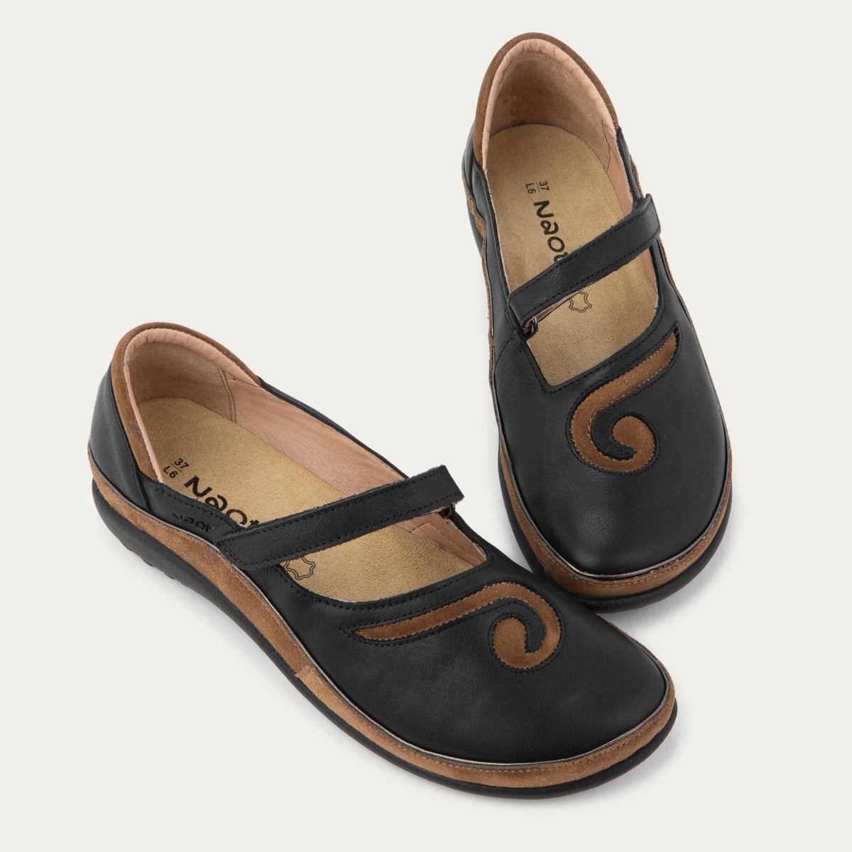 Pair brown and black brown and black Mary Jane on a textured sole.
