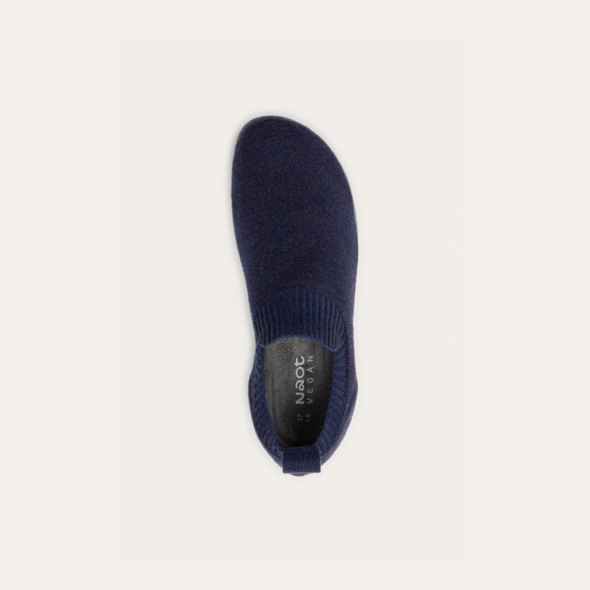 Top view of a navy knit slip-on vegan shoe