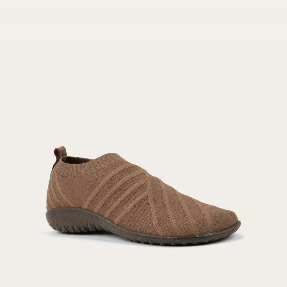 Angled side view of brown knit slip-on shoe on a gray sole