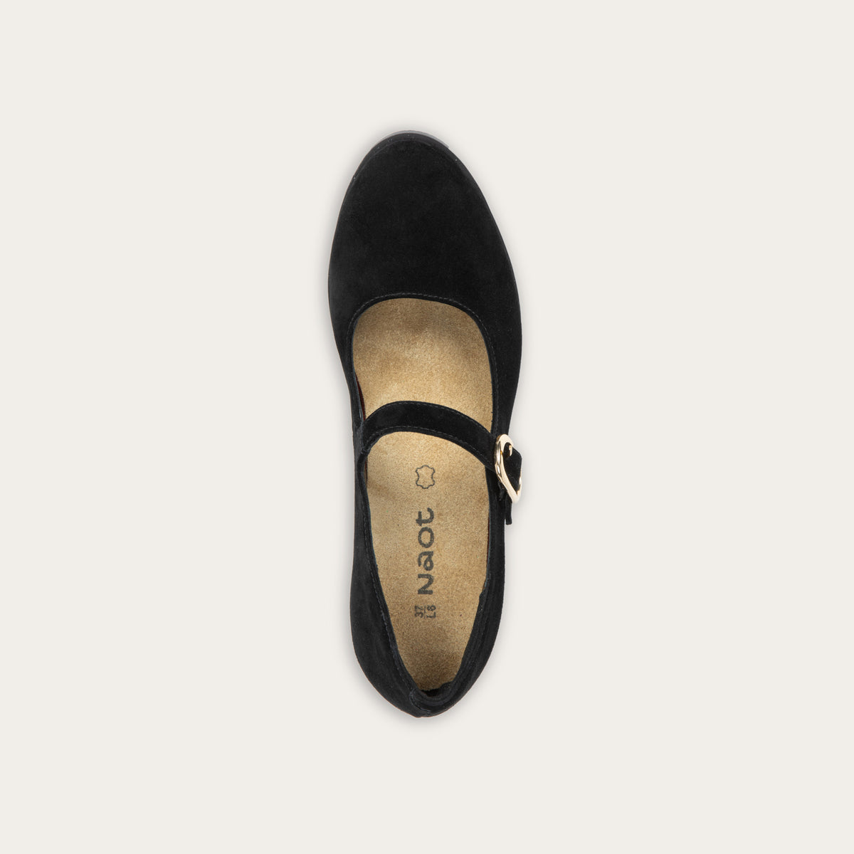 Top view of a black suede Mary Jane shoe with a rounded toe, a low block heel, and a thin strap across the instep secured by a polished gold-tone metal buckle.