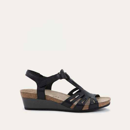 Profile view of a  black wedge sandal with strappy design, open toe, and adjustable ankle strap on a cork footbed.