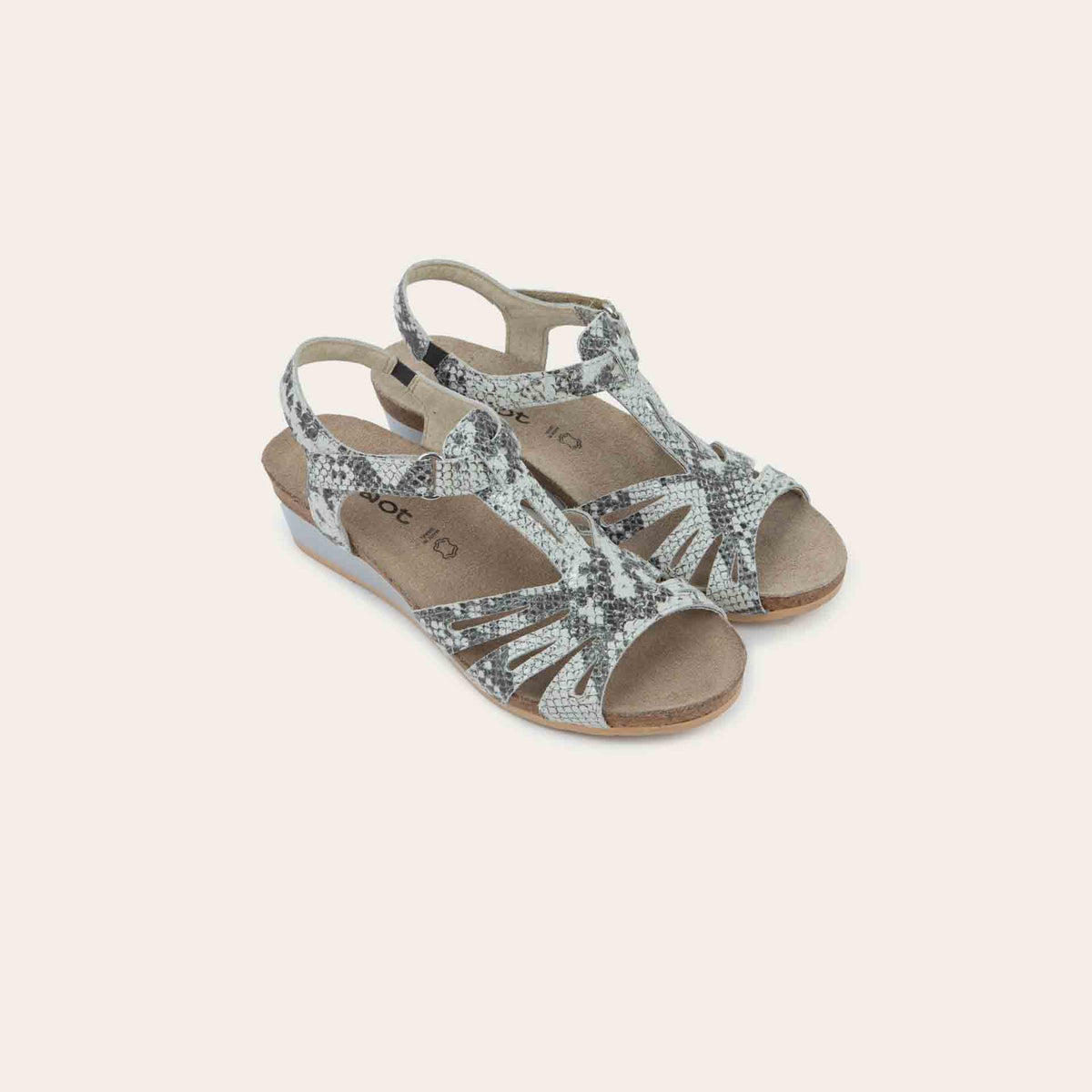 A pair of black wedge sandals with strappy design, open toe, and adjustable ankle strap on a cork footbed.