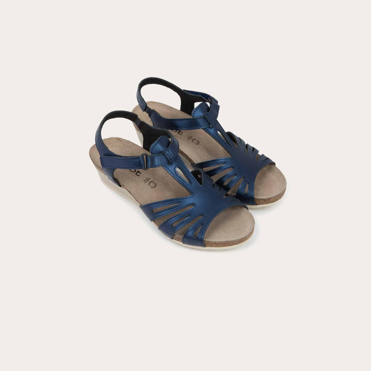 A pair of black wedge sandals with strappy design, open toe, and adjustable ankle strap on a cork footbed.