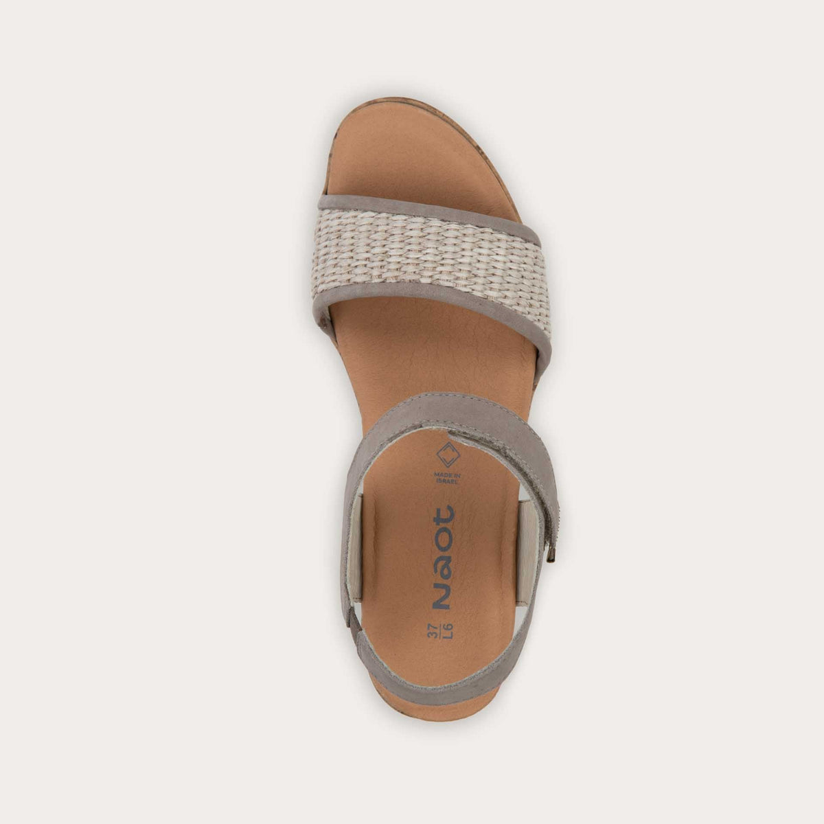 Top view of a wedge heeled sandal with a gray leather ankle strap, and woven beige front strap
