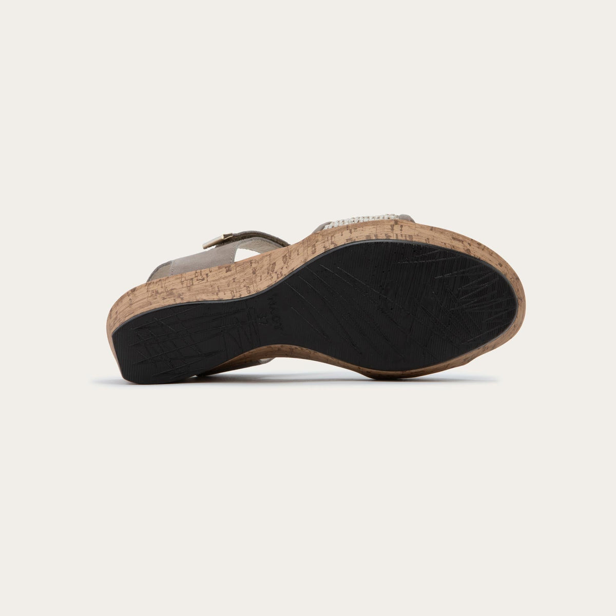 Bottom view of a wedge heeled sandal with a gray leather ankle strap, and woven beige front strap
