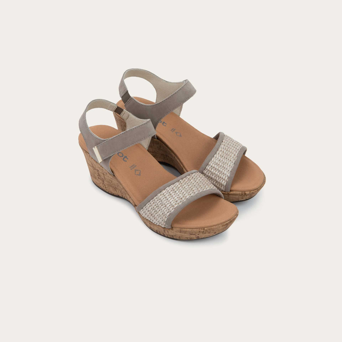 Pair of wedge heeled sandals with a gray leather ankle strap, and woven beige front strap