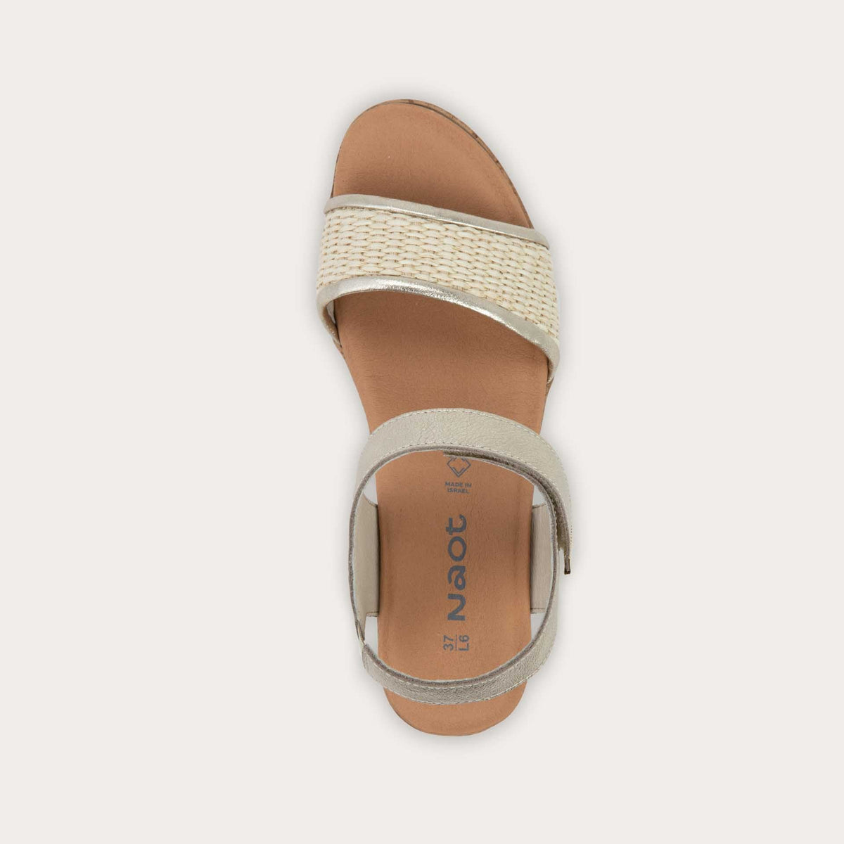 Top view of a wedge heeled sandal with a gold leather ankle strap, and woven beige front strap
