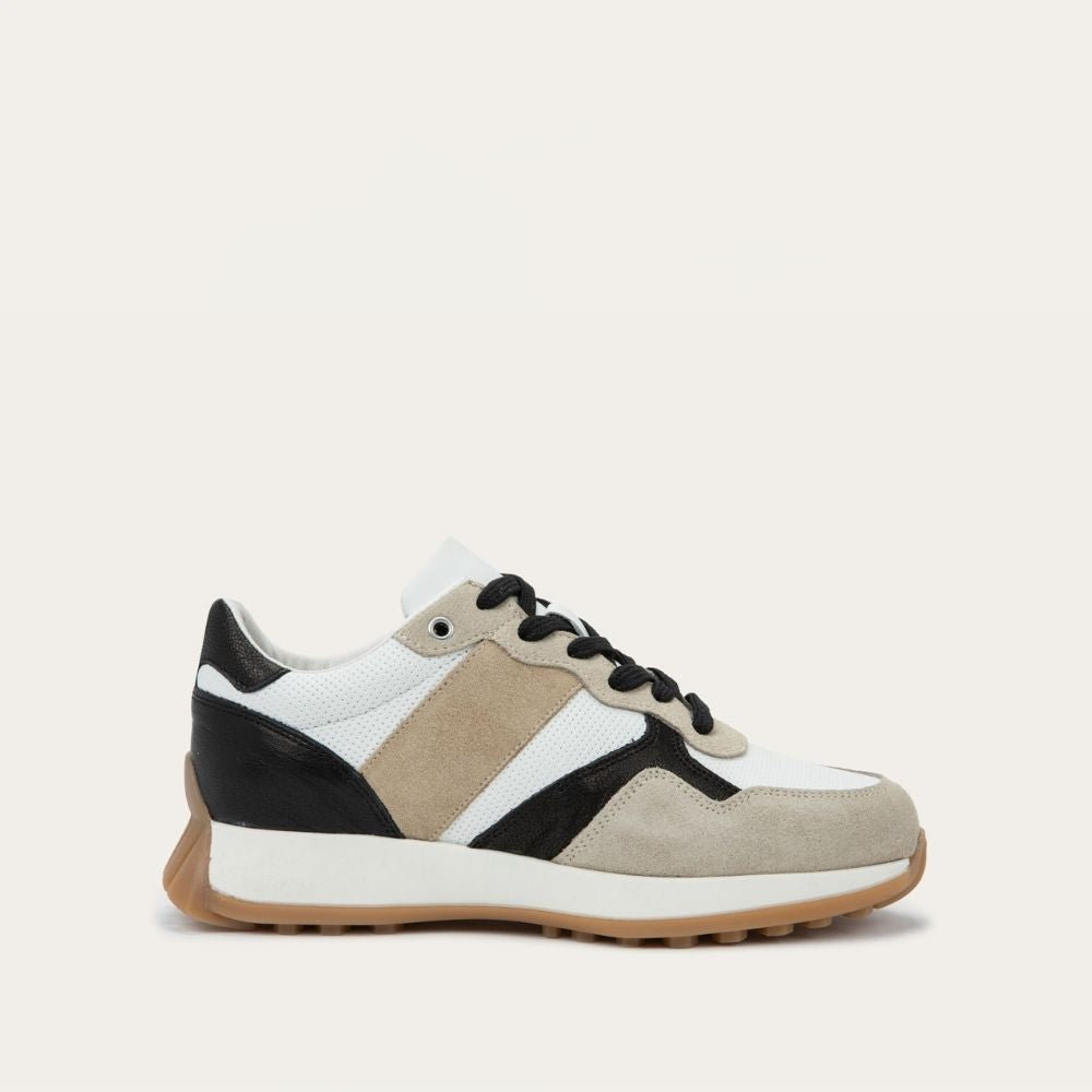 Sneaker with black, white, and beige color scheme on a light gray background