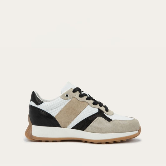 Sneaker with black, white, and beige color scheme on a light gray background