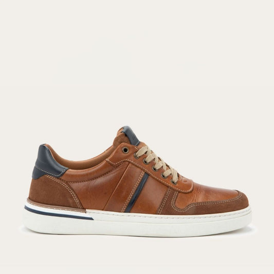 Brown leather sneaker with white sole on a light gray background