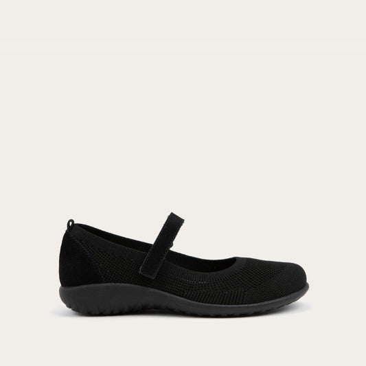 Profile view of a  black knit mary jane.