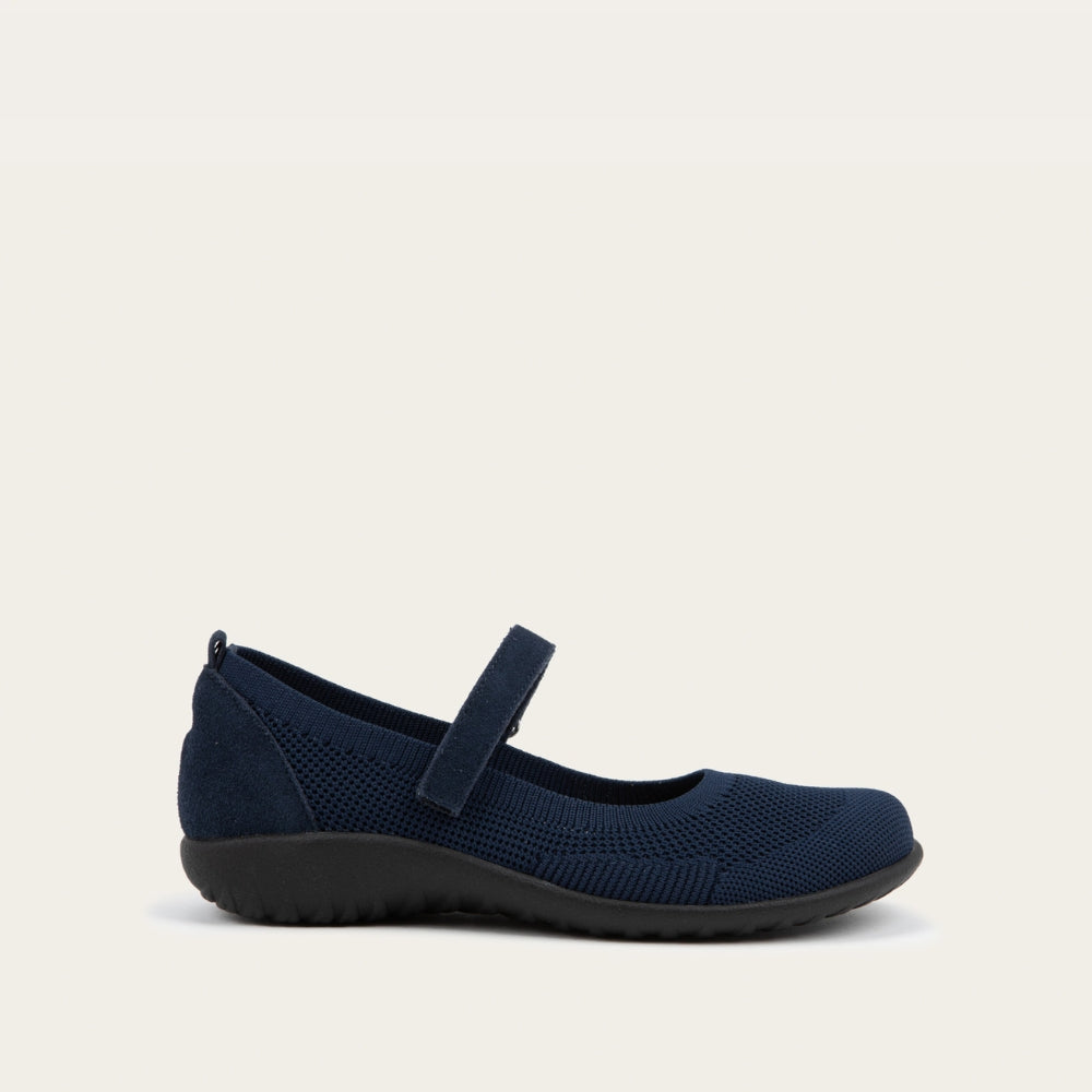 Profile view of a  blue knit mary jane.
