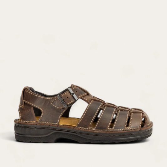 A brown Julius sandal by Naot, featuring a buckle strap at the instep and a closed toe.